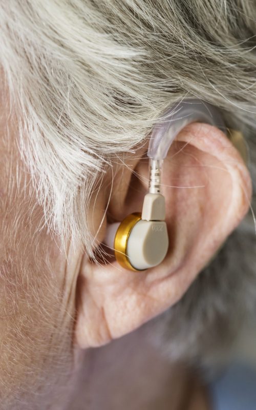 elderly-woman-wearing-hearing-aid
